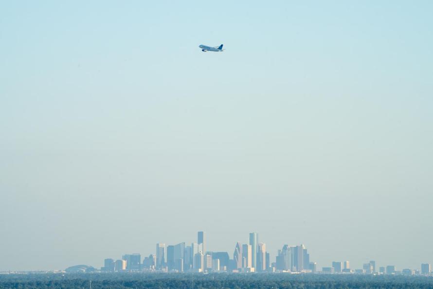 PLANE FLYING OVER HOUSTON