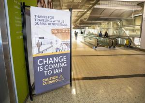 Billboard positioned inside Bush Airport alerts travelers to construction in international terminal: Change is Coming to IAH