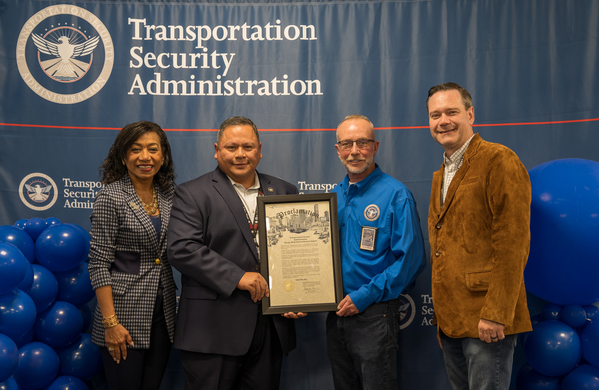 Members of Houston Airports and TSA pose for photo with City of Houston Proclamation