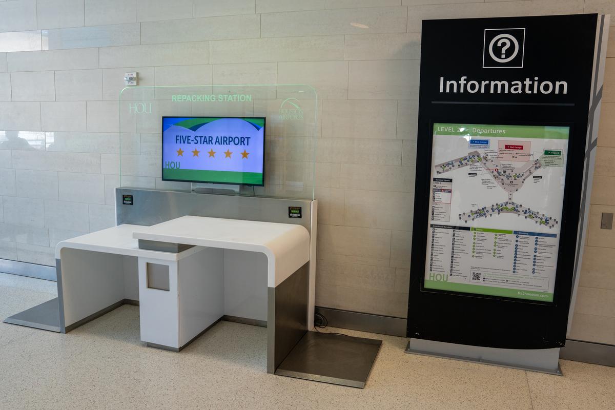 repacking station at Hobby Airport allows passengers to weight and adjust luggage before airline check-in