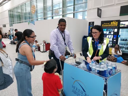 handing out water at Bush Airport